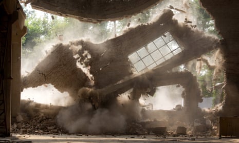 The walls of Chinese artist Ai Weiwei’s studio collapse during demolition.