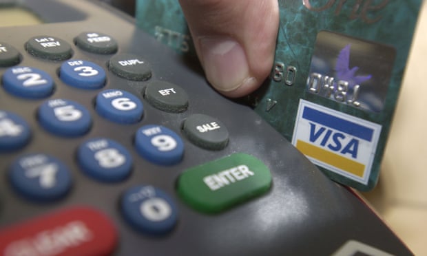 Credit card being swiped through a machine
