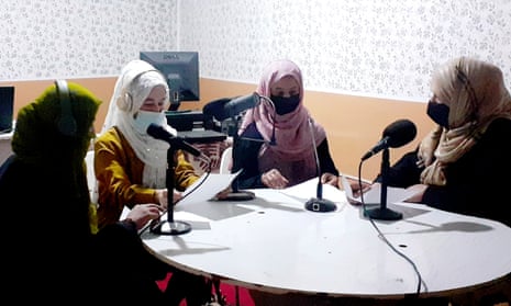 Najia Sorosh, right, head of Sadai Banowan, a women-run radio station, speaks with her staff in the broadcasting studio in Badakhshan province, north-eastern Afghanistan.