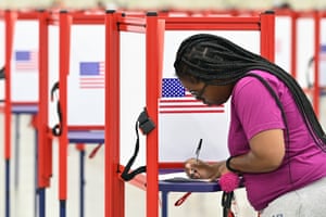 A voter fills out her ballot during the Kentucky Primary at the Kentucky Exposition Center in Louisville, Kentucky