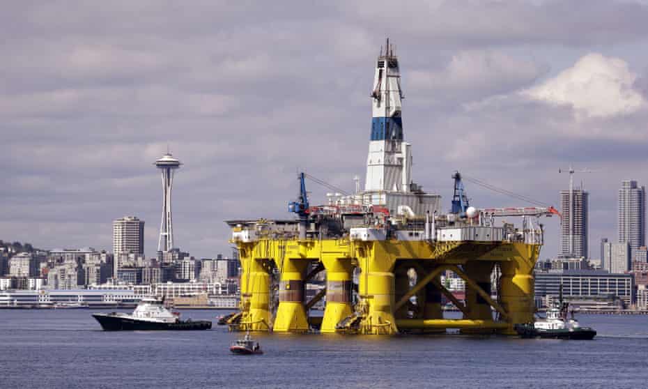 The oil drilling rig Polar Pioneer is towed toward a dock in Elliott Bay in Seattle. The rig is the first of two drilling rigs Royal Dutch Shell is outfitting for Arctic oil exploration. 