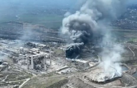 This image is taken from video released by Mariupol City Council on 19 April, showing smoke the above Azovstal steel plant and the destroyed gates of Azov Shipyard.