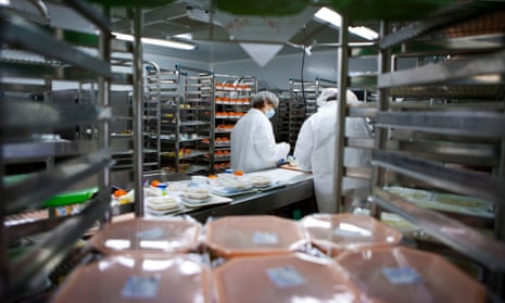 Caterers work at a hospital kitchen