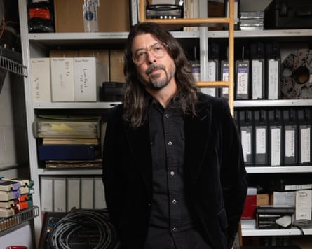 Dave Grohl successful Los Angeles, opinionated successful an agency pinch a woody ladder down him.