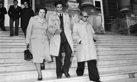 Goldman’s half-brother Jean-Jacques Goldman, centre, leaves court with his parents.