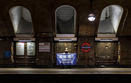 An asylum seeker holds a Hong Kong independence flag in London, February 2021. ‘I was arrested on 31 August 2019, after clashes between train commuters and pro-democracy demonstrators. I thought I was going to die from the pressure police were putting on my back.’