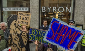 Protesters at a branch of the Byron burger chain