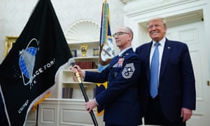 Donald Trump next to the the US space force flag on 15 May 2020, in the Oval Office.