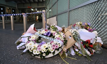 Floral tributes are left at the entrance to Westfield Bondi Junction shopping centre in Sydney