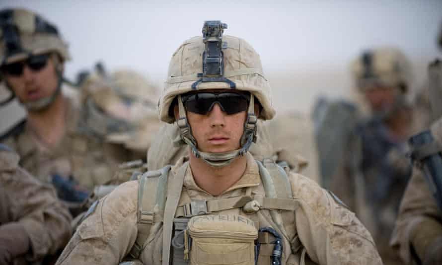 FILES-US-AFGHANISTAN-CONFLICT<br>(FILES) In this file photo US Marines from the 2nd Battalion, 8th Marine Regiment of the 2nd Marine Expeditionary Brigade wait for helicopter transport as part of Operation Khanjar at Camp Dwyer in Helmand Province in Afghanistan on July 2, 2009. - President Joe Biden’s decision to withdraw foreign troops from Afghanistan ushers in a new set of risks for the United States and its military. Officially, the Pentagon supports the US president’s decision to end America’s longest war. But many senior US commanders have been voicing their misgivings for months. (Photo by MANPREET ROMANA / AFP) (Photo by MANPREET ROMANA/AFP via Getty Images)
