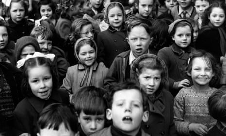 Children return to school after their dinner break circa 1952. 