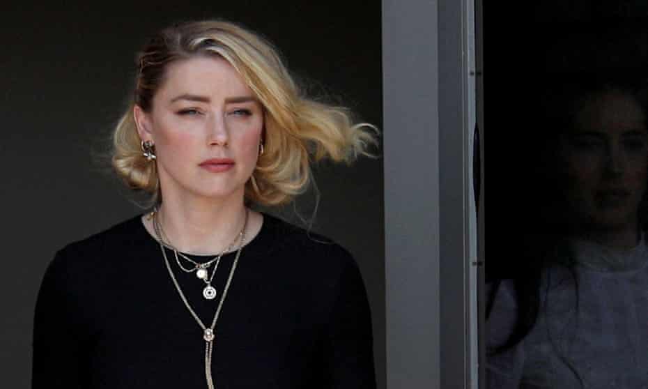 Amber Heard leaves court after the jury announced split verdicts in the Depp v. Heard civil defamation trial.