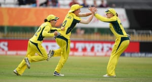 Nicole Bolton celebrates with Elyse Villani and Kristen Beams after Villani caught Smitri Mandhana for six.