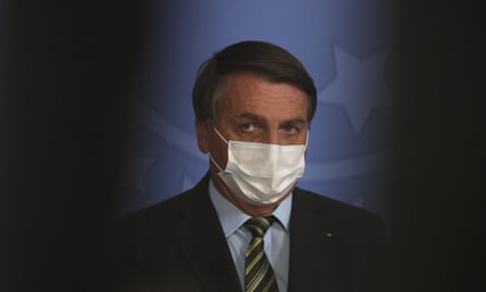 Jair Bolsonaro threatened reporter on Sunday when he asked president to explain why a former policeman with alleged links to Rio’s mafia had paid thousands of pounds into the bank account of his wife.