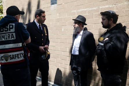 men speak with each other outside a building