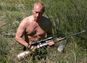 August 2007: Putin is pictured carrying a hunting rifle in the Republic of Tuva