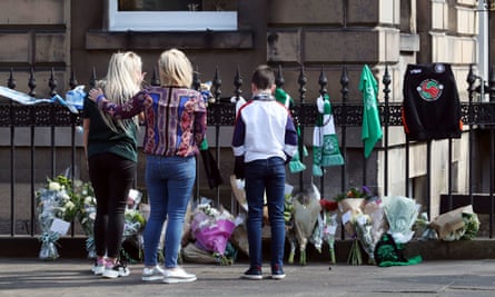People view floral tributes on Chester Street in Edinburgh.
