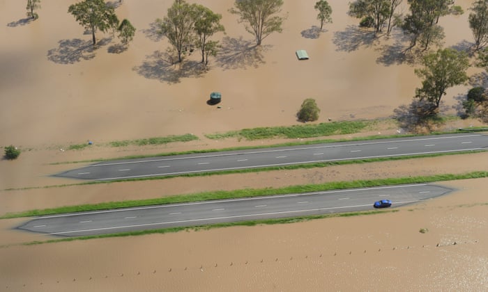 A car is stranded in flood waters on the Warrego Highway west of Brisbane, Australia on 12 January 2011.