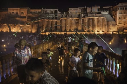 Ethnic Uighurs watch a laser and water show as part of a local government tourism development in the old town of Kashgar in Xinjiang province, China. Kashgar has long been considered the cultural heart of Xinjiang for the province’s nearly 10 million Muslim Uighurs