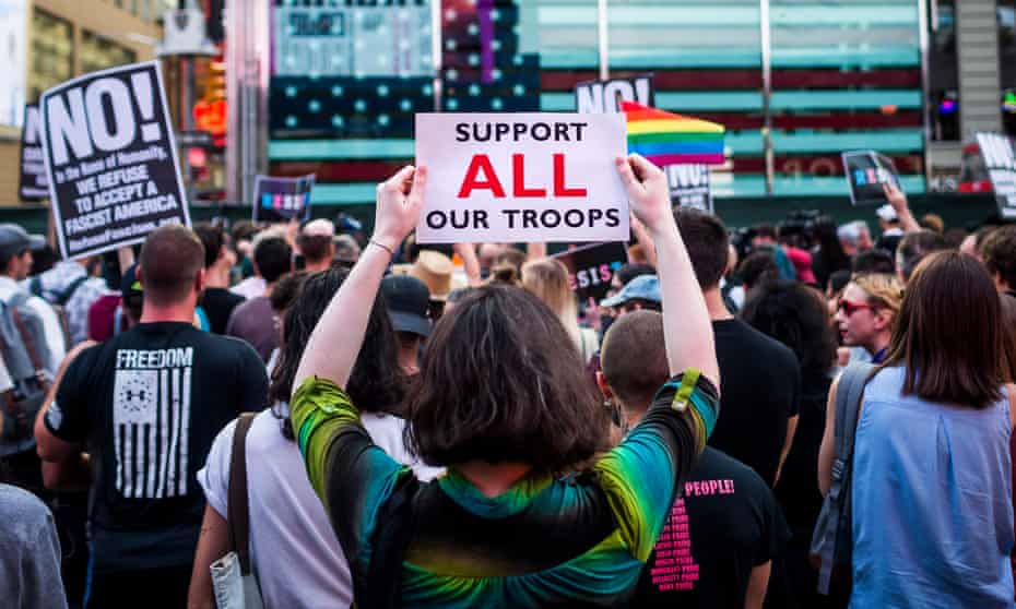People protest Donald Trump’s proposed ban on transgender people from military service in New York City on 26 July 2017. 