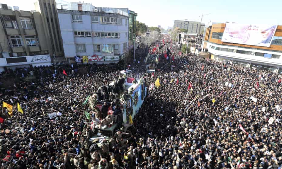 Coffins of Qassem Soleimani and others who were killed in Iraq by a US drone strike, are carried on a truck surrounded by mourners during a funeral procession, in the city of Kerman, Iran.