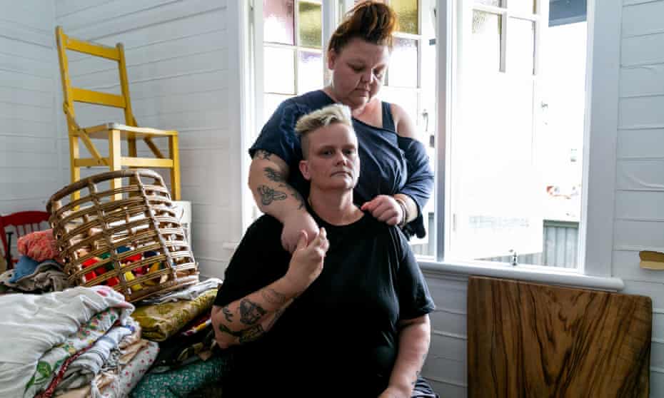 Kym Strow and her wife Sarah Jones in their Lismore home. Strow says people need a leader who gives support and hope. ‘People sure as fuck shouldn’t have to ask for it.’
