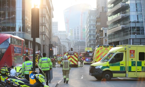 Firefighters and ambulances at the scene on Whitechapel High Street in London.