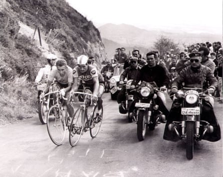 Jacques Anquetil and Raymond Poulidor climb the Puy de Dôme in July 1964 with motorcyclists alongside them