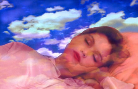 Illustrative image of a woman asleep against a backdrop clouds in a blue sky