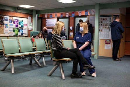 Mount talks with a patient at Folly Lane medical centre.