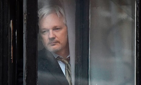 Julian Assange goes out to the balcony of the Ecuadorian embassy in 2016