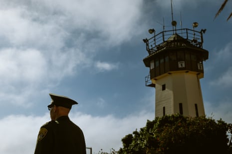 guard stands near watchtower