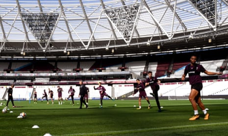 Winston Reid, right, and the rest of the West Ham United squad are put through their paces during Saturday’s training session at the London Stadium.