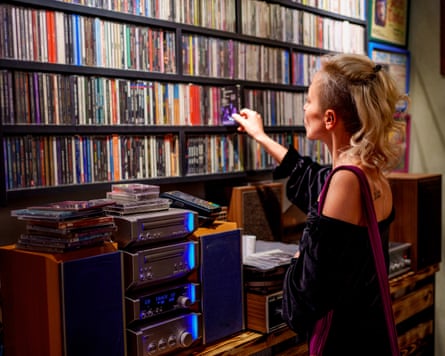 Woman browsing shelves of CDs
