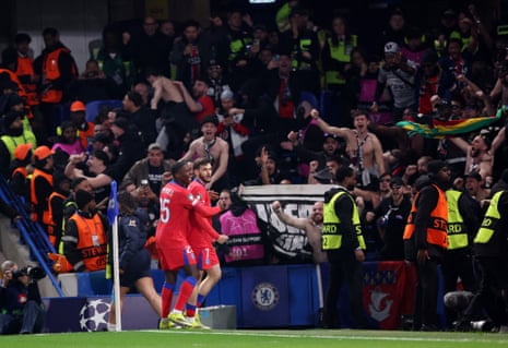 Paris St Germain’s Khvicha Kvaratskheli (right) celebrates scoring their first goal with Nuno Mendes in front of the joyous PSG fans.