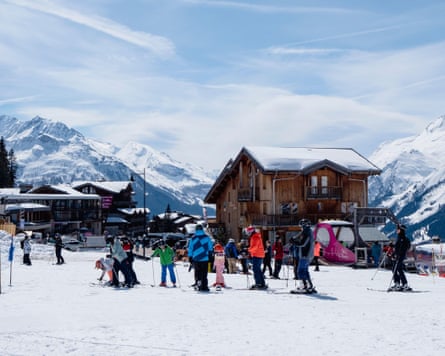 Skiers in family friendly French Alps ski resort of La Rosiere, Bourg-St-Maurice