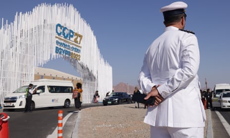 A traffic policeman stands outside the main entrance of Cop27 in Sharm el-Sheikh, Egypt