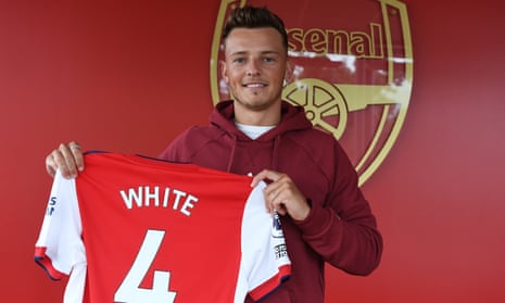 Ben White holds his Arsenal shirt after signing from Brighton on a five-year contract.