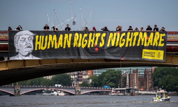 Amnesty International drops a banner from Vauxhall Bridge opposite the US embassy in London in a protest against Donald Trump’s visit to the United Kingdom last July