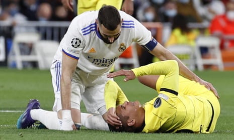 Real Madrid’s striker Karim Benzema (left) checks on Chelsea’s defender Thiago Silva.