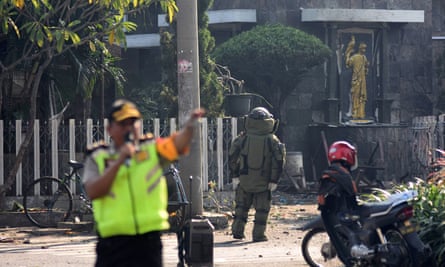 Indonesian bomb squad member approaches church in Surabaya