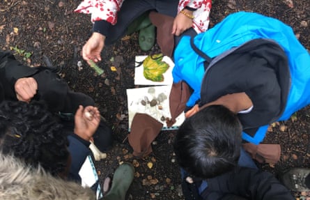 Children share treasures back at camp at a Wild Things forest school