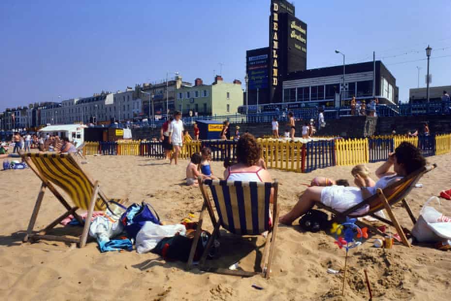People in deckchairs on Margate beach in the 1980s