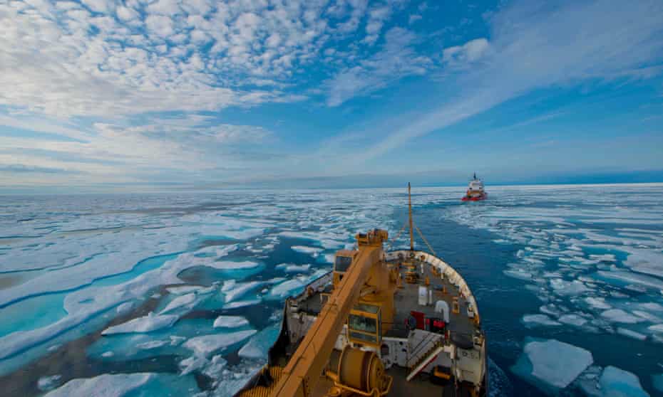A US Coast Guard vessel follows the Canadian Coast Guard's heavy icebreaker through the icy waters of the Franklin Strait in August 2017