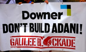 Anti Carmichael coalmine protesters hold a banner outside the AGM for the Australian diversified mining contractor Downer EDI in Sydney.