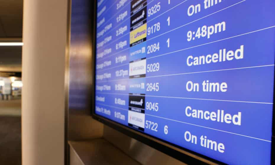Airport departure board showing cancelled flights