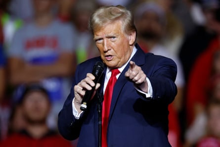 Former US President and Republican presidential candidate Donald Trump gestures as he speaks at a campaign rally at the Fiserv Forum in Milwaukee, Wisconsin, November 1, 2024.