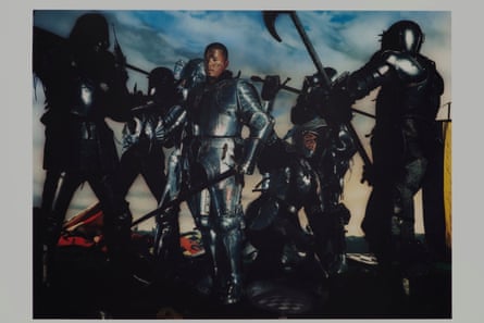 Alexander McQueen in full armour, lowering his sword