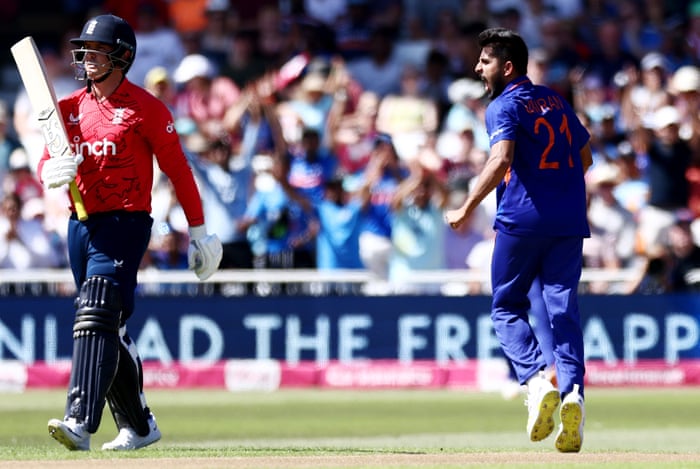 Malik of India celebrates taking the wicket of Roy.