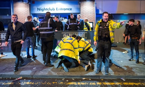 Police detain a man following a fight outside Manchester’s Birdcage nightclub.